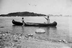 Two young women in a canoe.