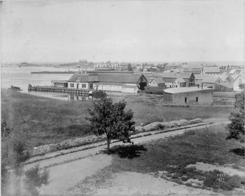 The original wooden shed railroad terminal appears in the center of the photo above. Photo by Baldwin Coolidge.